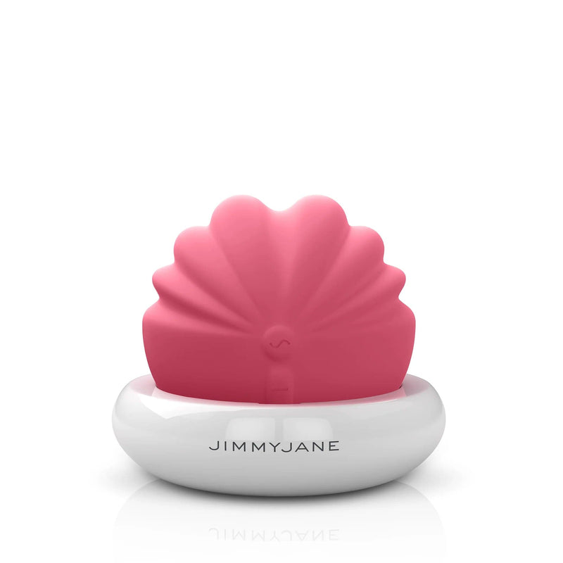 Front-facing shell shaped clitoral vibrator in charging base JJ-salmon
