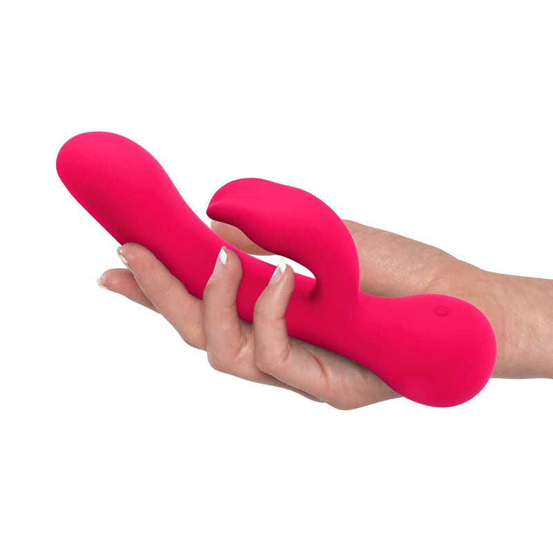 Top-facing silicone rabbit vibrator pink in a white woman&
