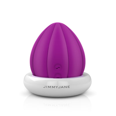Front-facing clitoral vibrator in charging base magenta